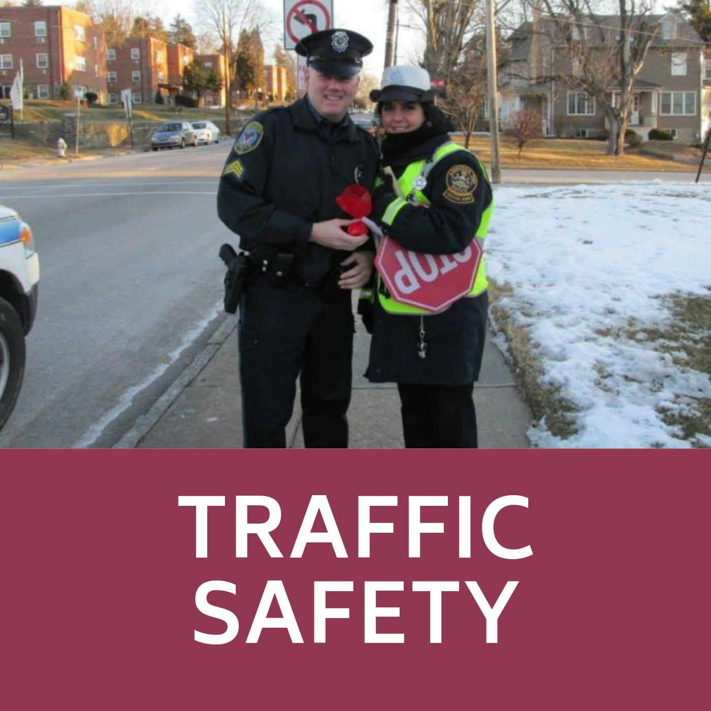 Crossing guard and police officer that links to traffic safety information