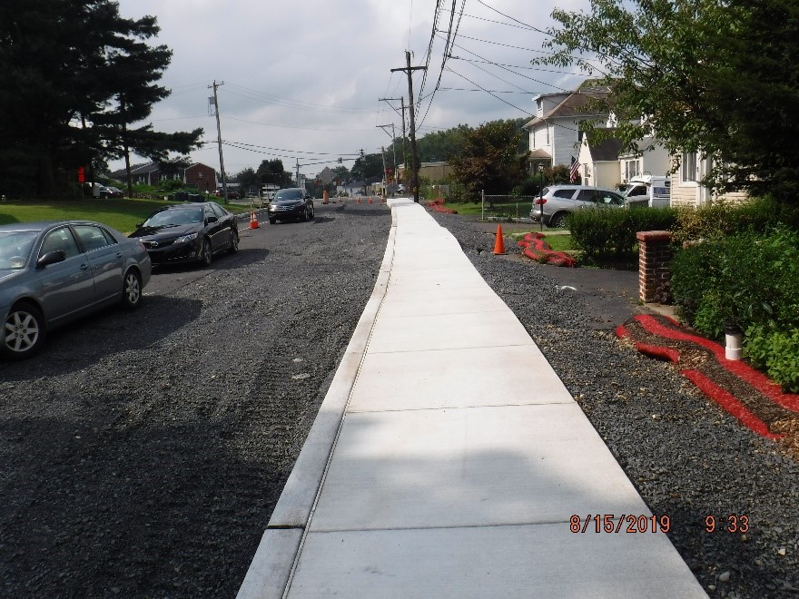 New concrete curb and sidewalk construction