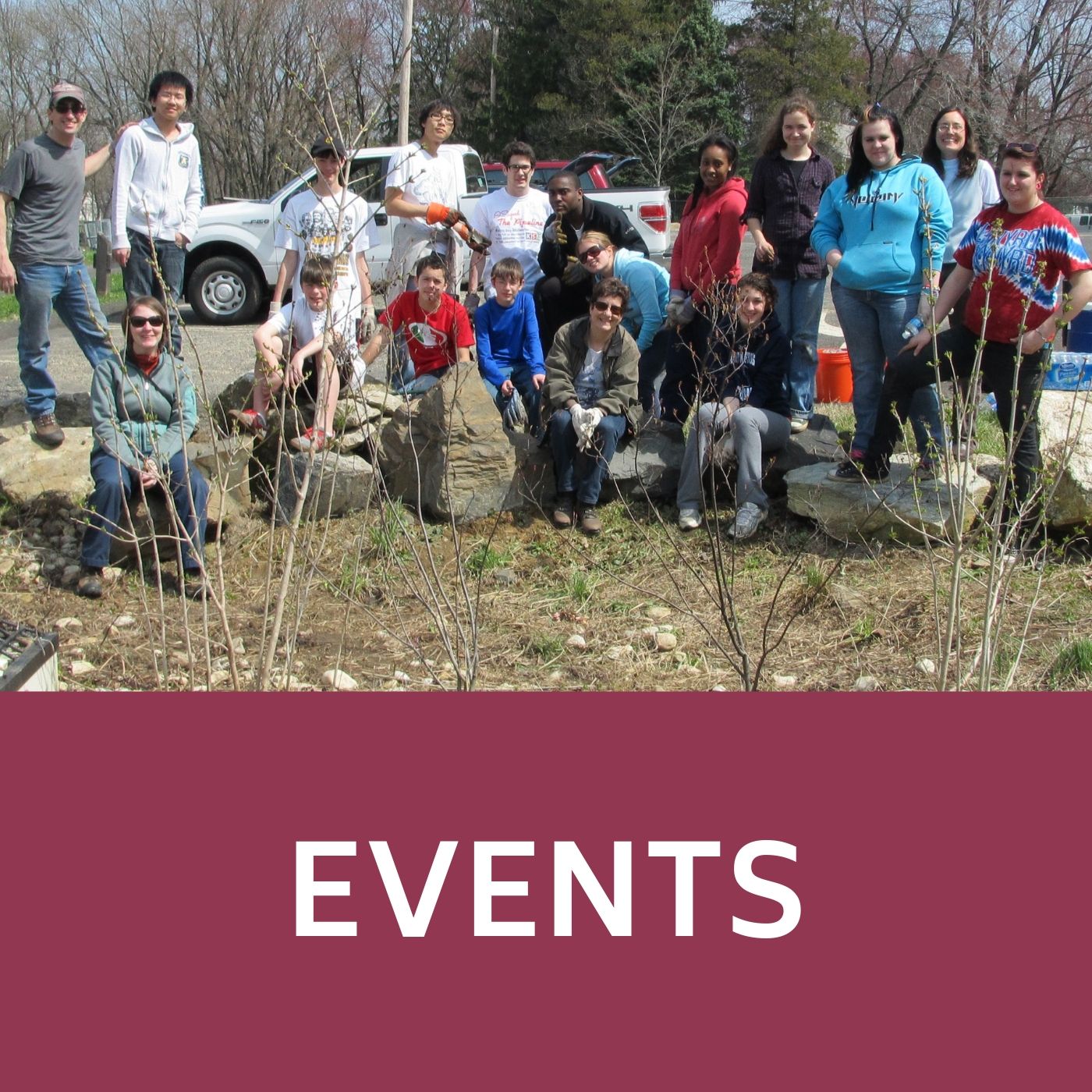 Group picture at an Earth Day clean-up event that redirects to information about events.