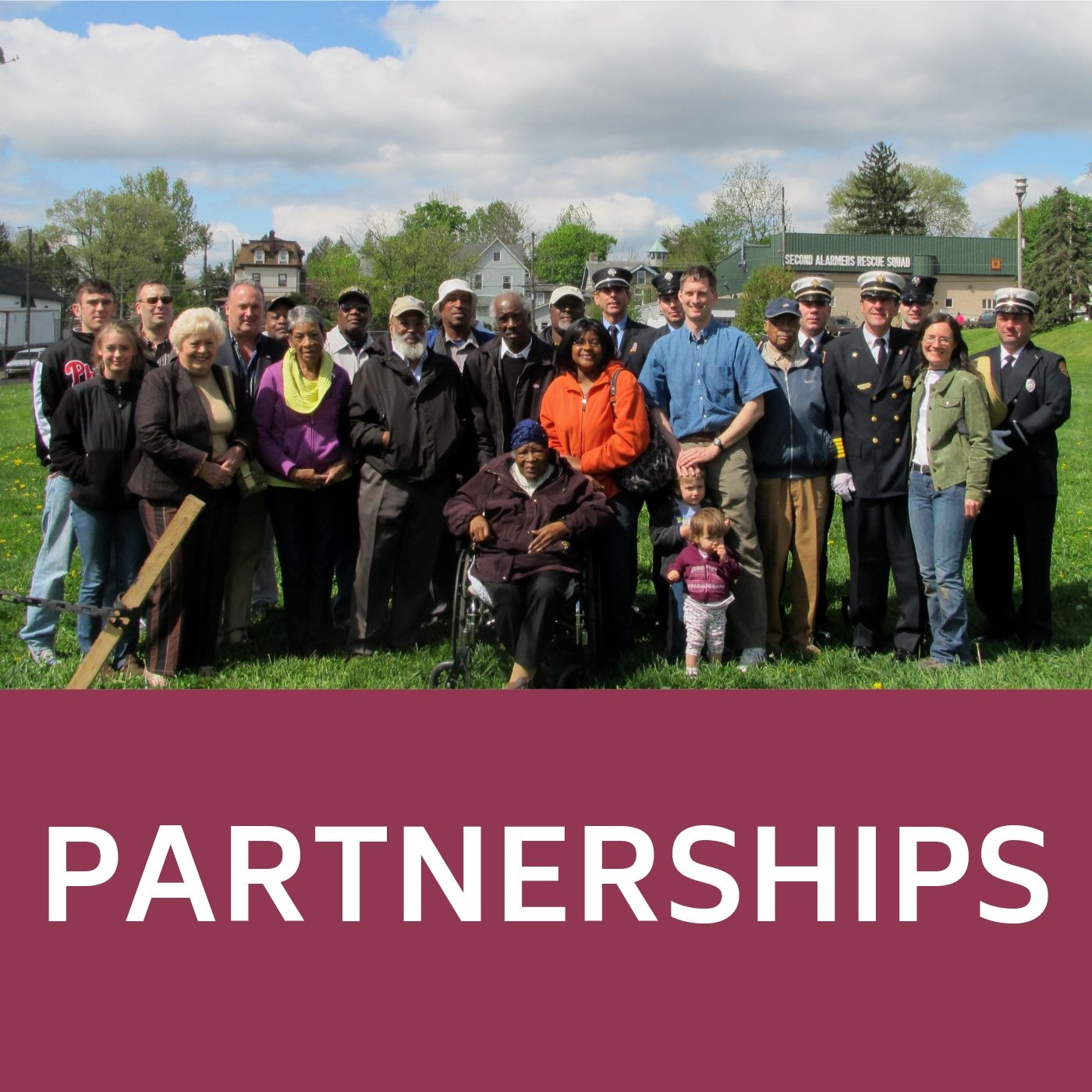 EJ Memorial Park Group picture of volunteers that redirects to information about partnerships.