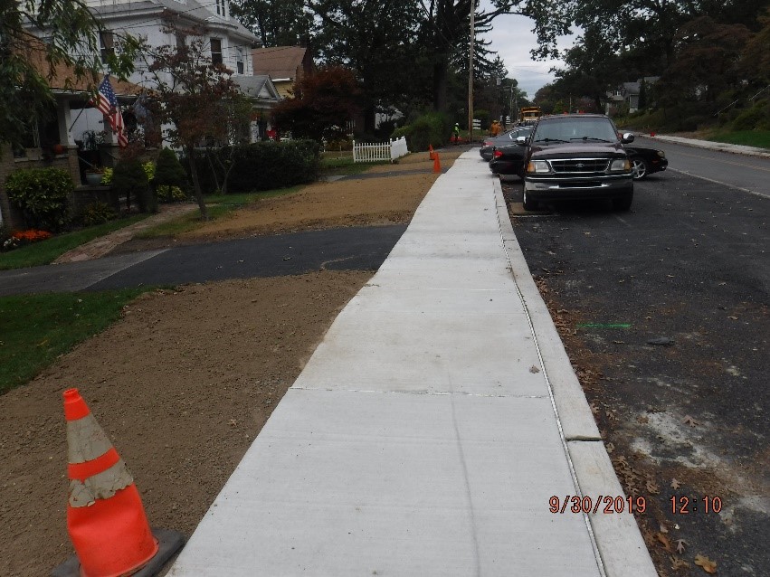 New concrete curb and sidewalk construction on the north side of tyson