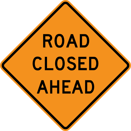 Traffic sign saying Road Closed Ahead