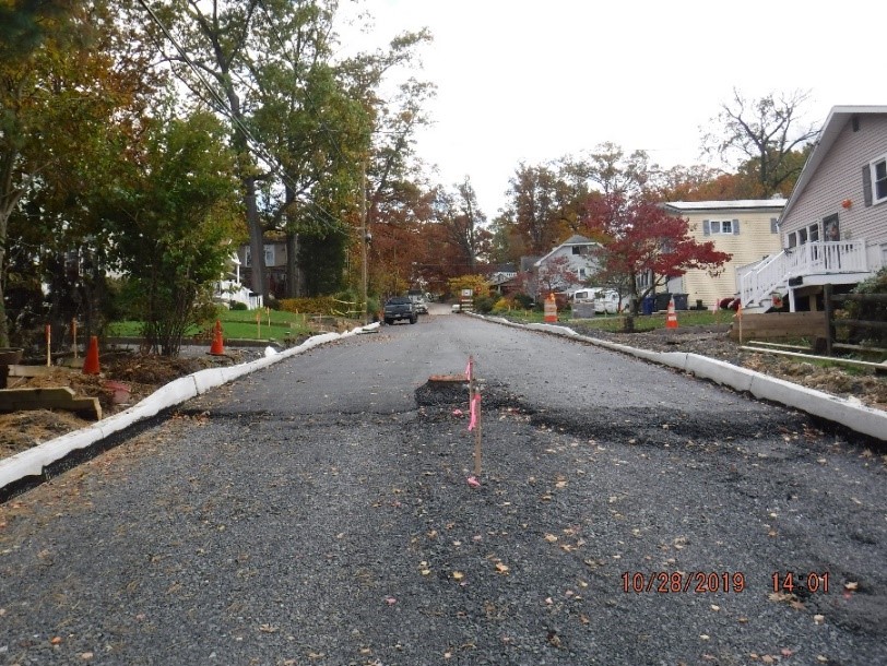 New concrete curb and asphalt pavement on Edgecomb Ave. looking towards Edge Hill Road