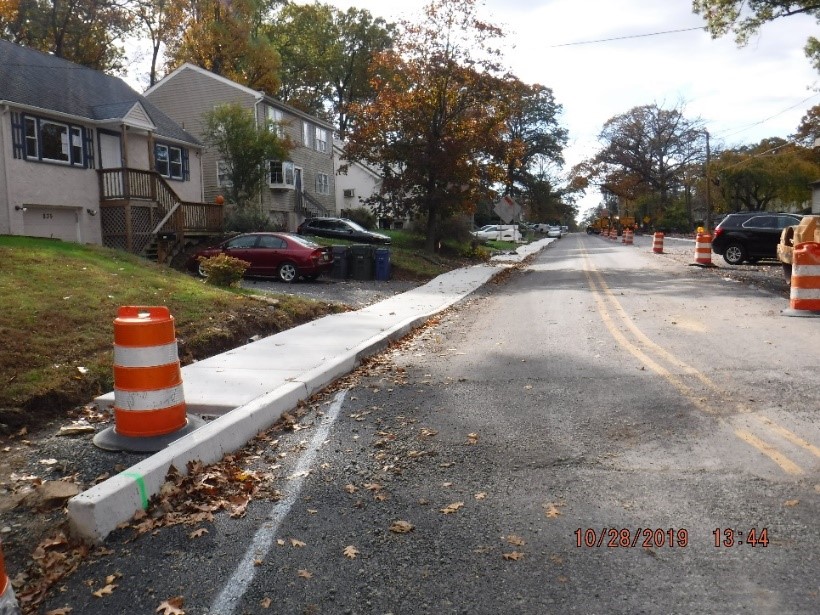 New concrete curb and sidewalk on the south side of Tyson west of Carson Avenue