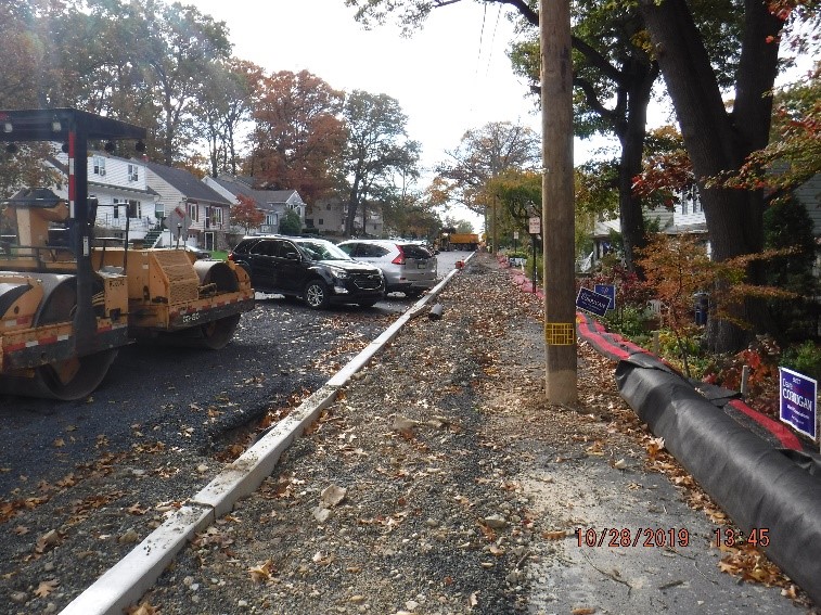 New concrete curb construction on the north side