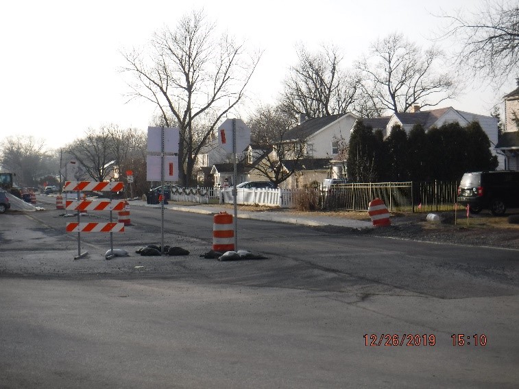 Asphalt pavement, curb and sidewalk construction on Tyson Ave. west of Bradfield Rd.