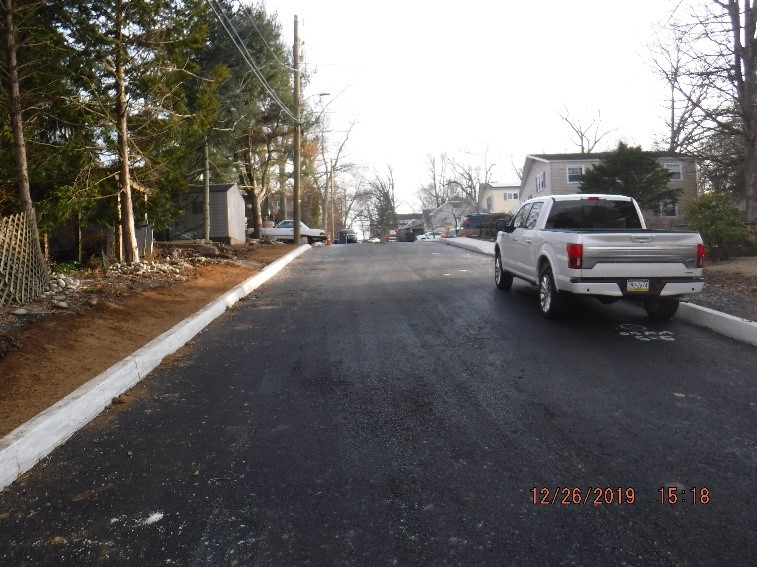 New asphalt, curb and sidewalk construction on Edgecomb Avenue