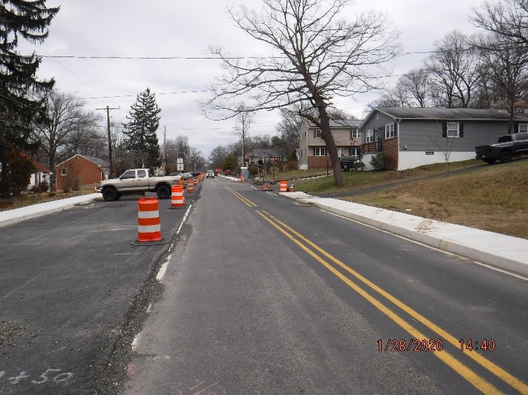 Asphalt pavement, curb, and sidewalk construction on Tyson Avenue east of Custer Avenue