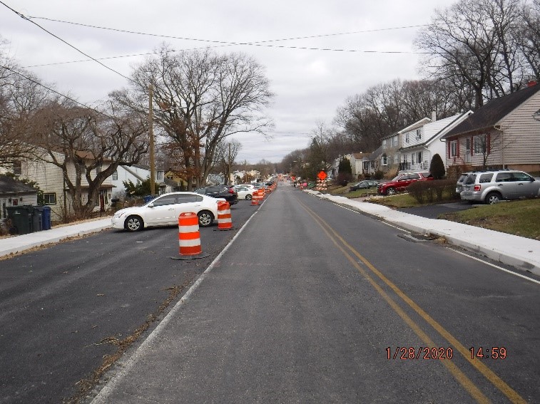 Asphalt pavement, curb and sidewalk construction on Tyson Avenue east of Edgecomb Avenue