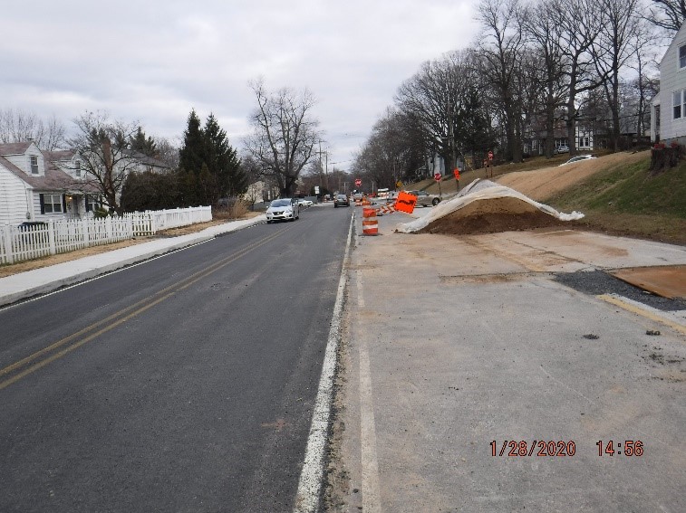 Asphalt pavement, curb, and sidewalk construction on Tyson Avenue west of Bradfield Road