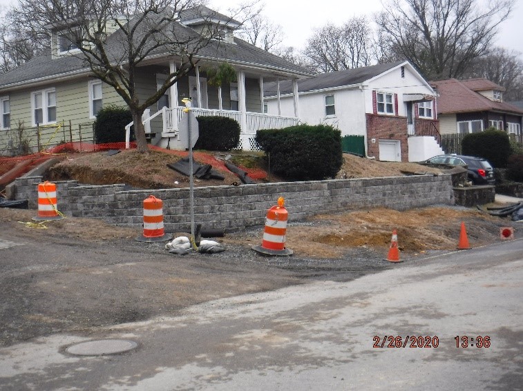 Landscape retaining wall construction at the intersection of Tyson and Custer Avenues