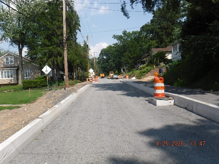 New roadway and curb construction on Edge Hill Road looking east