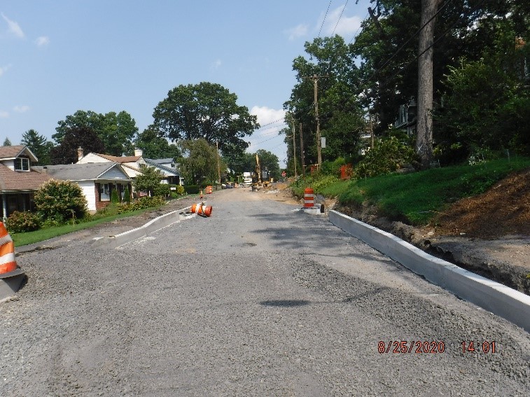 New roadway and curb construction on Edge Hill Road looking east towards Custer Avenue