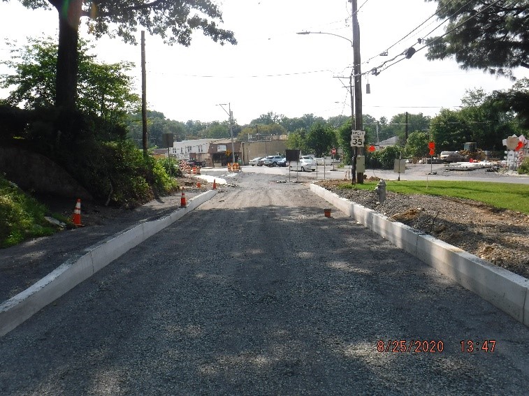 New roadway and curb construction on Edge Hill Road looking west