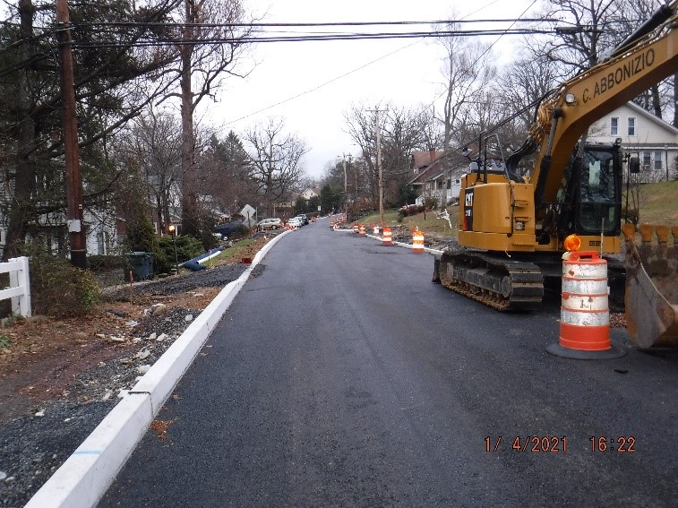 Roadway paving and new concrete curb on Edge Hill Road between Custer Avenue and Bradfield Road