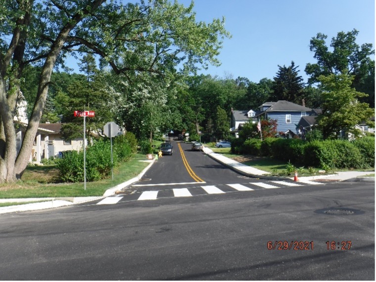 Final asphalt wearing course pavement with line striping on Ardsley Ave. looking south.