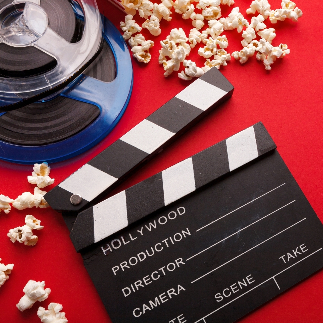 Image of popcorn, clapboard, and movie reel